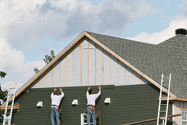 Professional Storm Damage Siding Repair technician working in Central Islip, NY